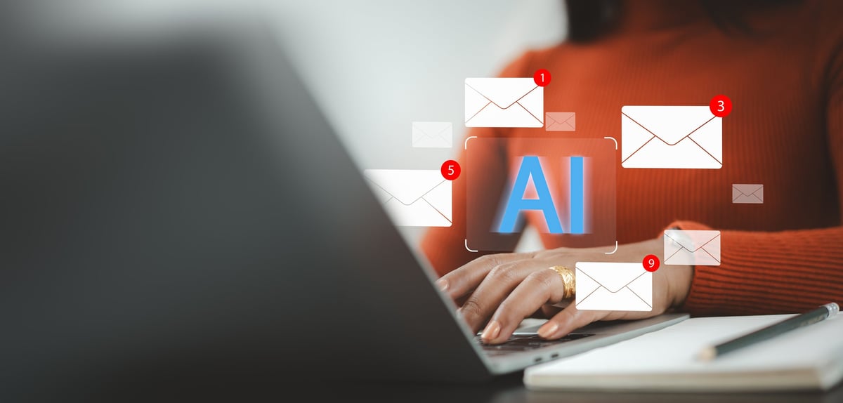 Close up of business woman using laptop with AI icon and email notifications. Concept of artificial intelligence automation, smart inbox, digital marketing, and modern office workflow.